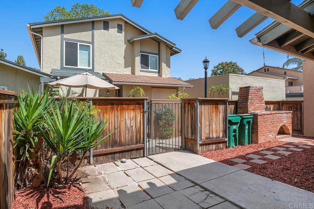 10281 Alphonse Street Santee, CA 92071 - Photo 2 of 26 a front view of a house with garden