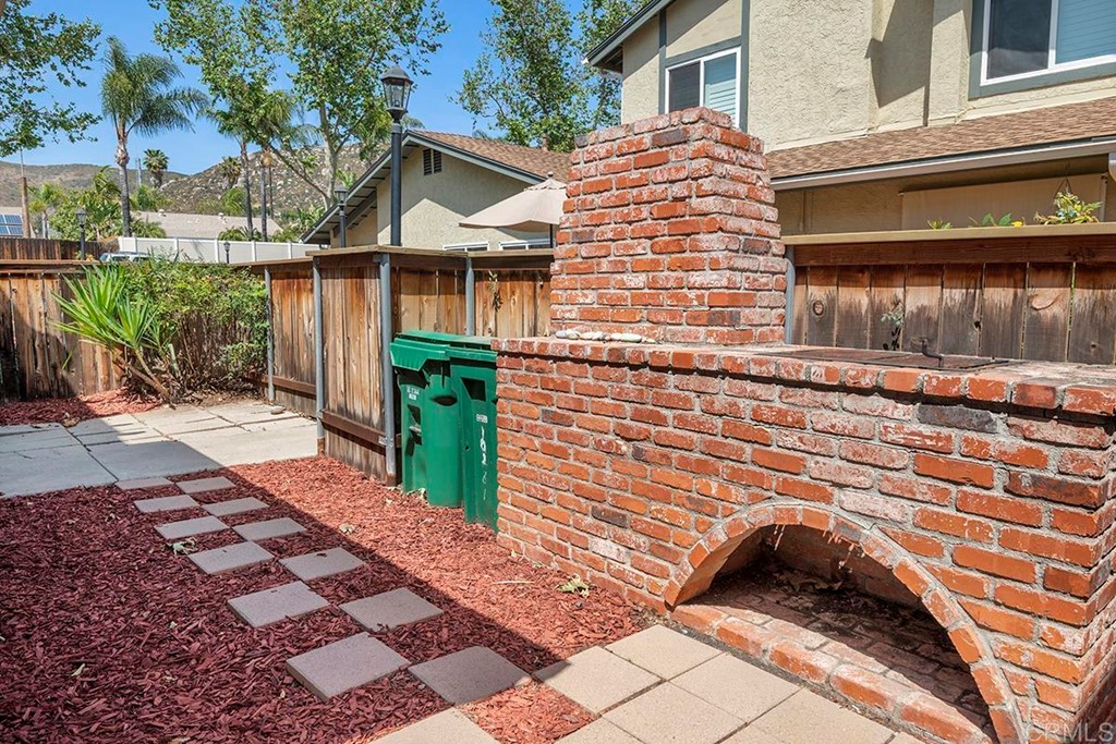 10281 Alphonse Street Santee, CA 92071 - Photo 3 of 26 a front view of a house with garden