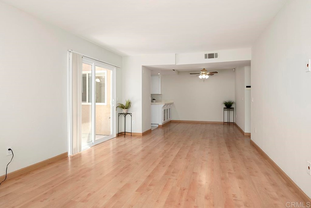10281 Alphonse Street Santee, CA 92071 - Photo 8 of 26 a view of a big room with wooden floor and windows