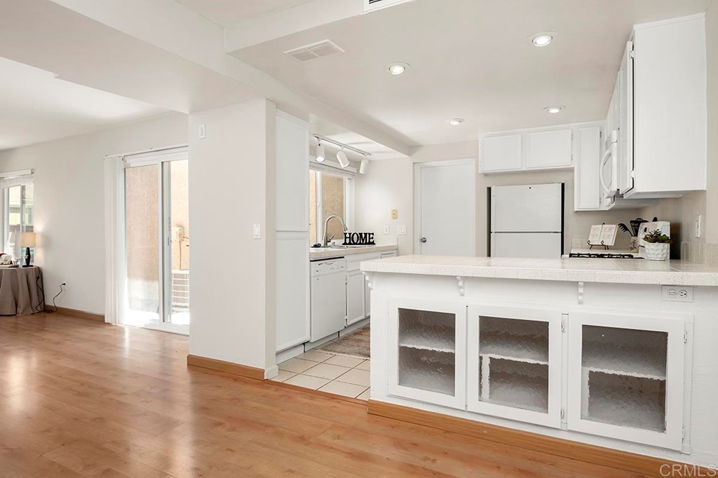 10281 Alphonse Street Santee, CA 92071 - Photo 10 of 26 a kitchen with stainless steel appliances granite countertop a sink and cabinets