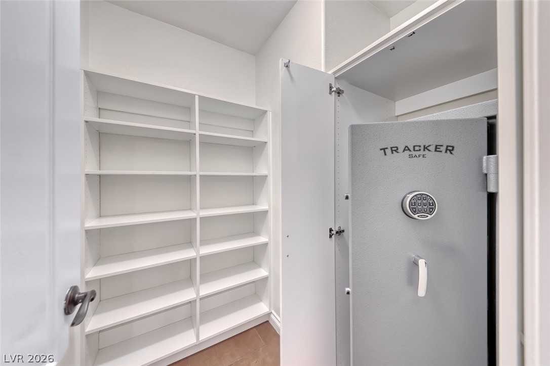 2122 Mooreview Street Henderson, NV 89012 - Photo 33 of 44 Secure storage solutions with built-in shelving offer organized space.