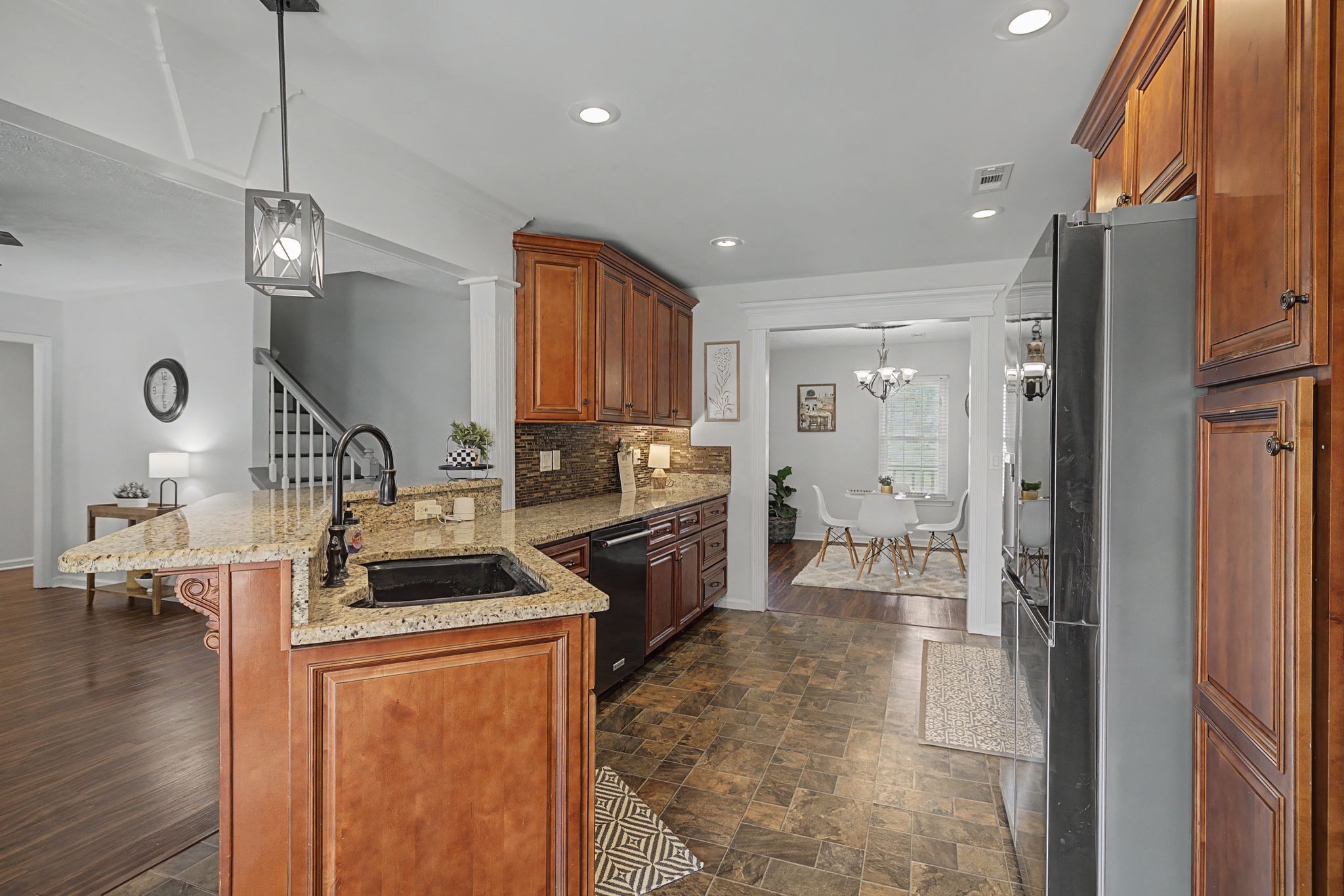 1123 Bramble Trail Murfreesboro, TN 37129 - Photo 14 of 41 a kitchen that has a lot of cabinets stainless steel appliances and a wooden floor