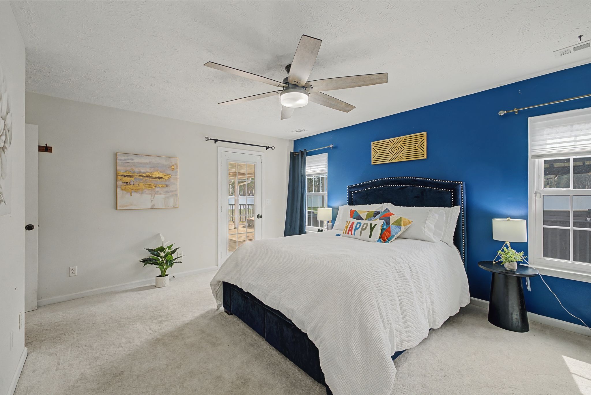 1123 Bramble Trail Murfreesboro, TN 37129 - Photo 17 of 41 a bedroom with a large bed potted plant and a ceiling fan