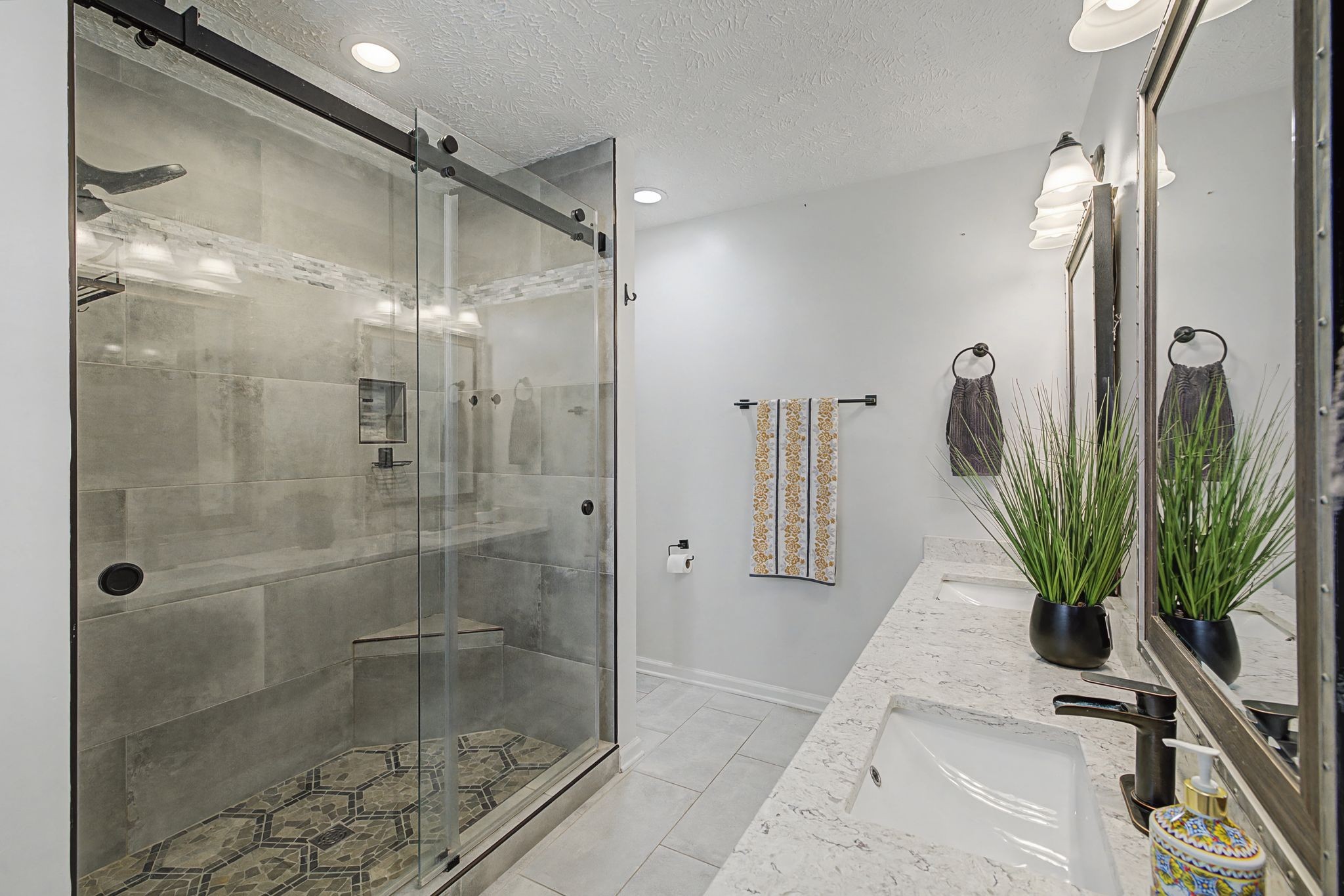 1123 Bramble Trail Murfreesboro, TN 37129 - Photo 20 of 41 a bathroom with a shower a plant and a glass door