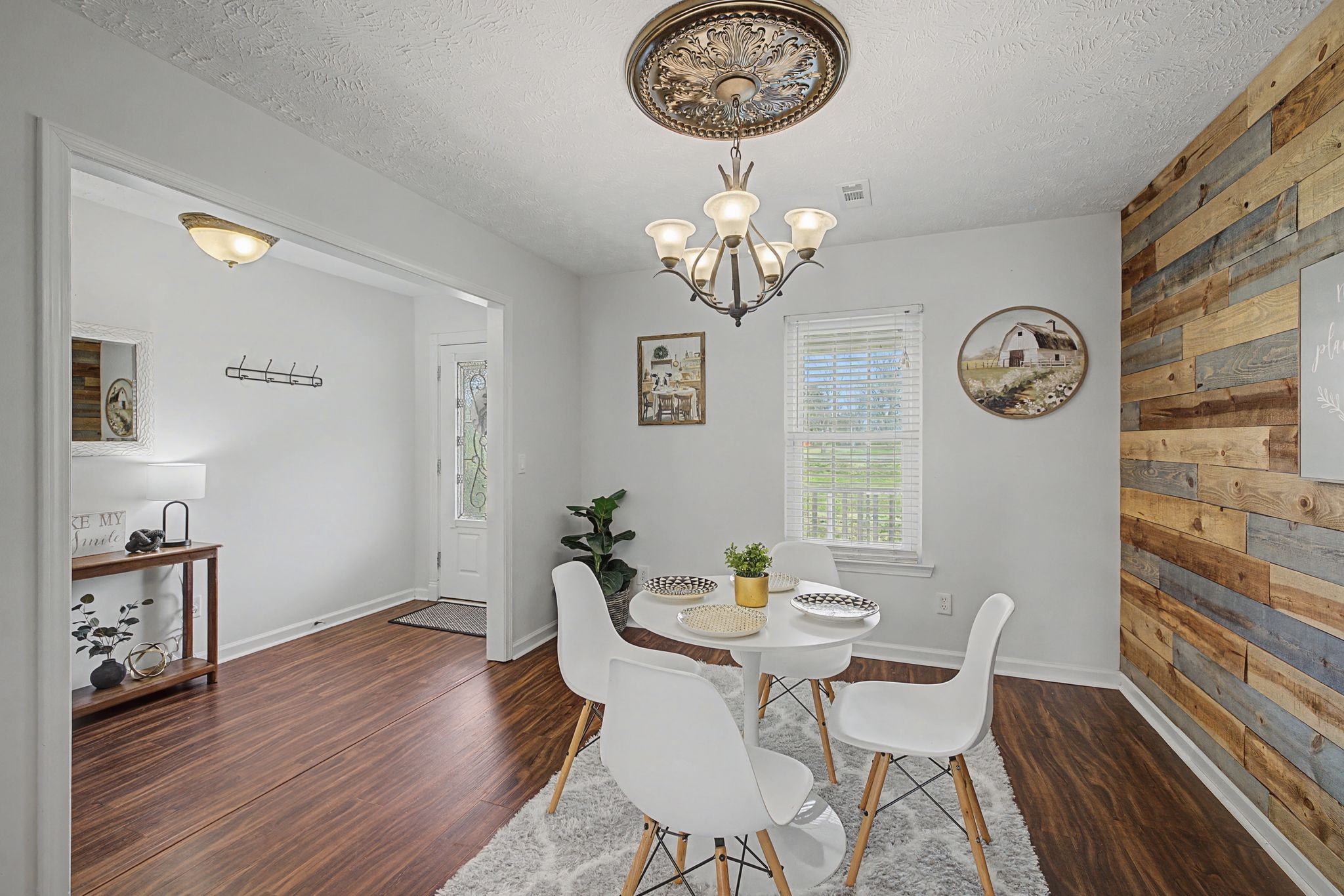 1123 Bramble Trail Murfreesboro, TN 37129 - Photo 8 of 41 a view of a dining room with furniture a chandelier and wooden floor
