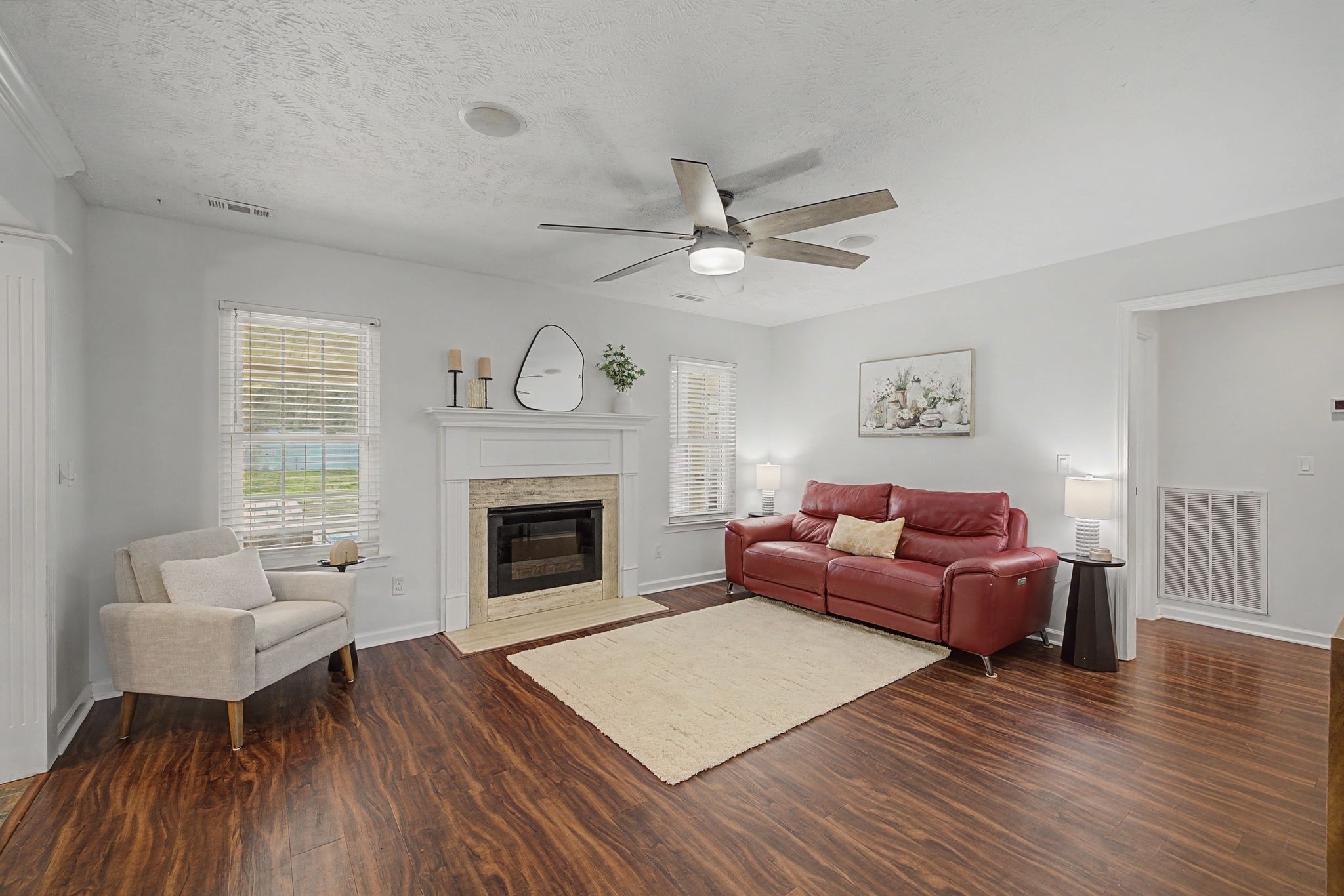 1123 Bramble Trail Murfreesboro, TN 37129 - Photo 9 of 41 a living room with furniture a fireplace and wooden floor