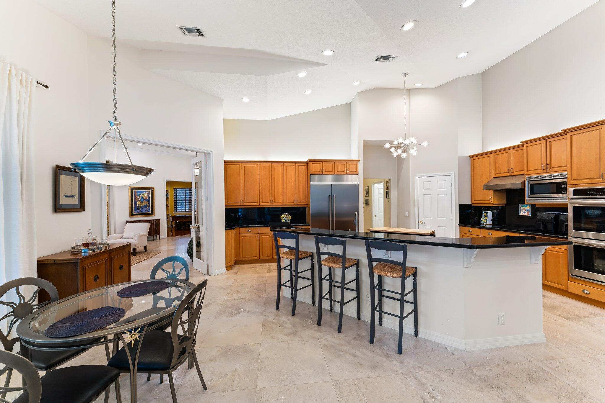 248 River Drive Tequesta, FL 33469 - Photo 12 of 65 a view of a dining room with furniture