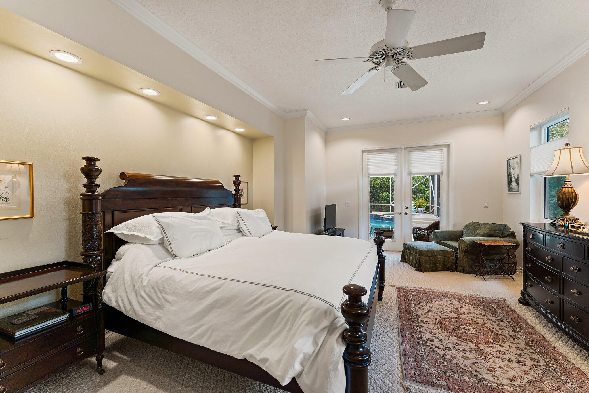 248 River Drive Tequesta, FL 33469 - Photo 14 of 65 a bedroom with a bed a couch and dresser