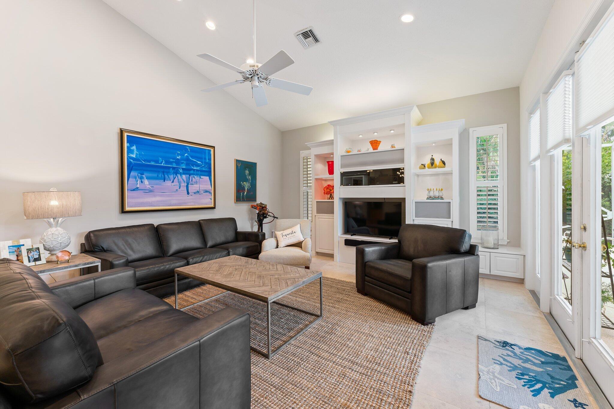 248 River Drive Tequesta, FL 33469 - Photo 18 of 65 a living room with furniture and a fireplace