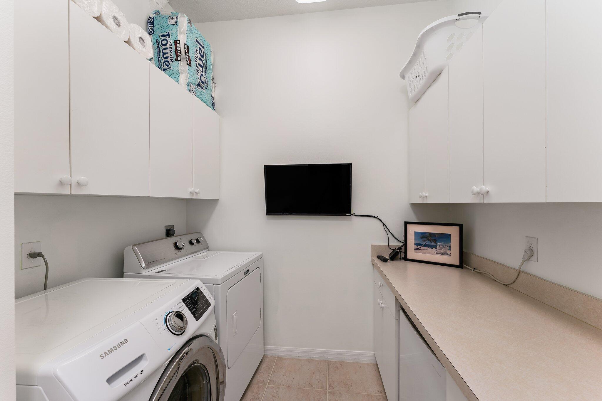 248 River Drive Tequesta, FL 33469 - Photo 24 of 65 a utility room with dryer and washer