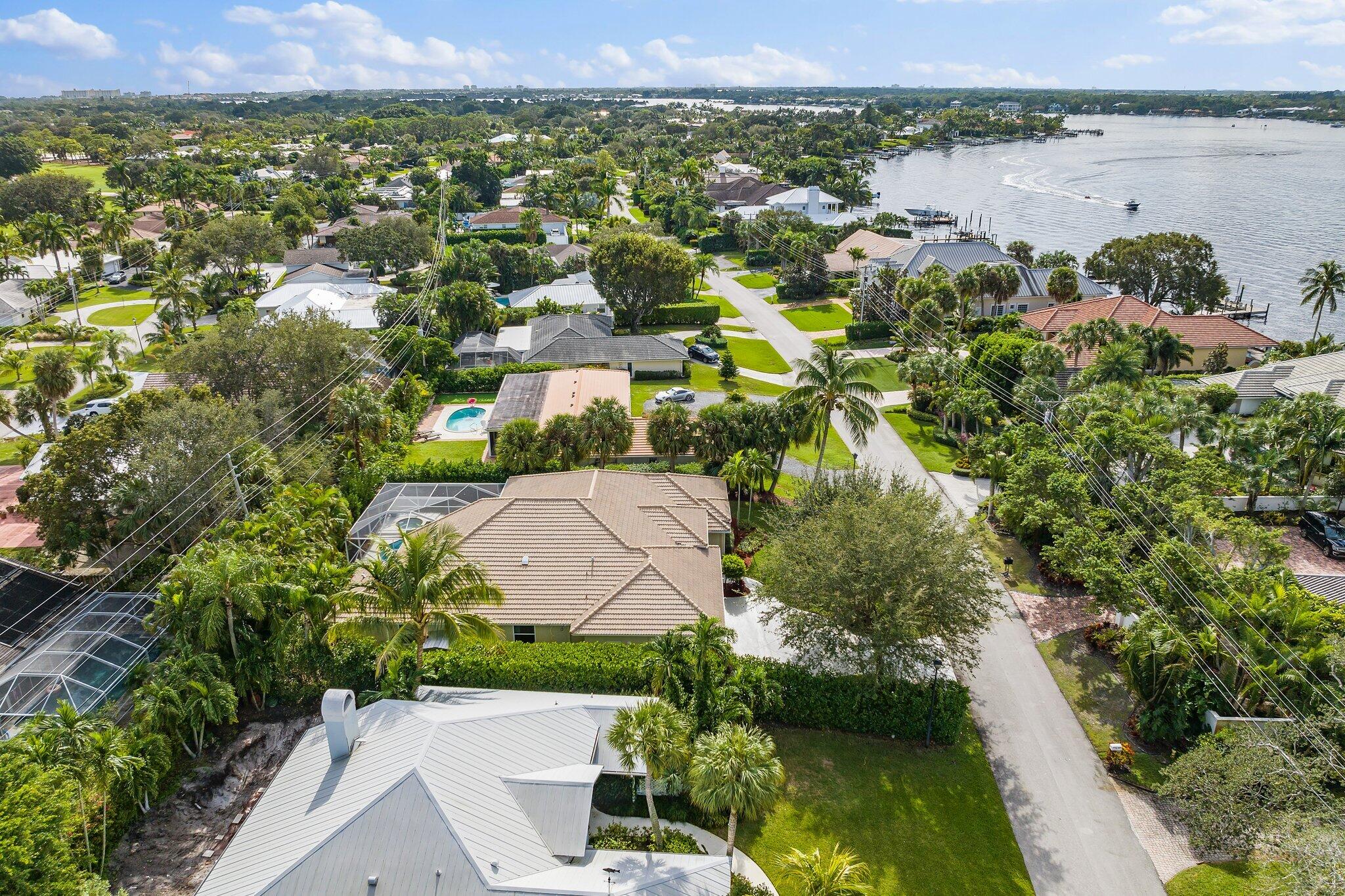 248 River Drive Tequesta, FL 33469 - Photo 27 of 65 an aerial view of a house with a lake view