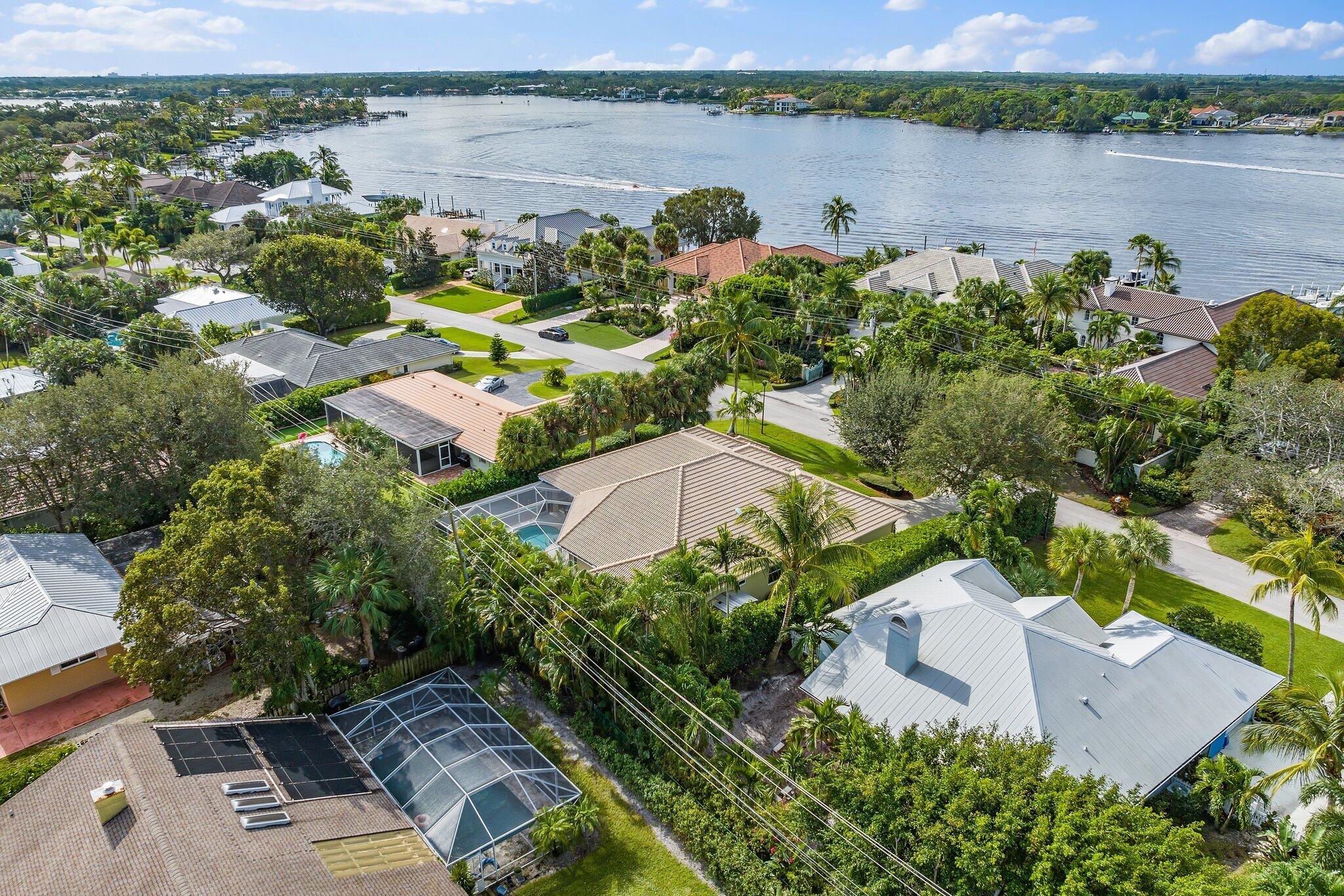 248 River Drive Tequesta, FL 33469 - Photo 28 of 65 an aerial view of a house with a lake view