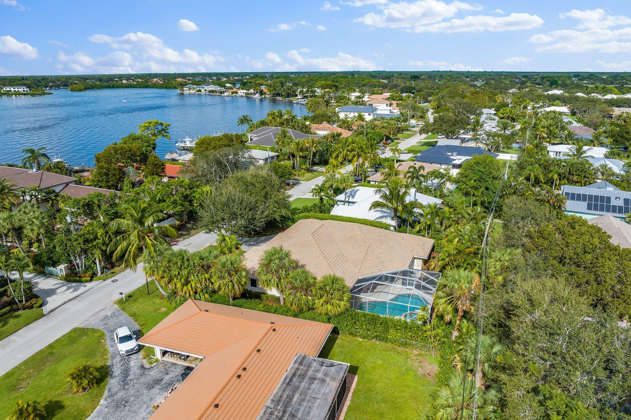 248 River Drive Tequesta, FL 33469 - Photo 31 of 65 an aerial view of residential houses with outdoor space and swimming pool
