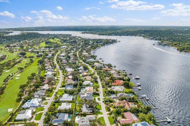 a view of a dining room with furniture and window