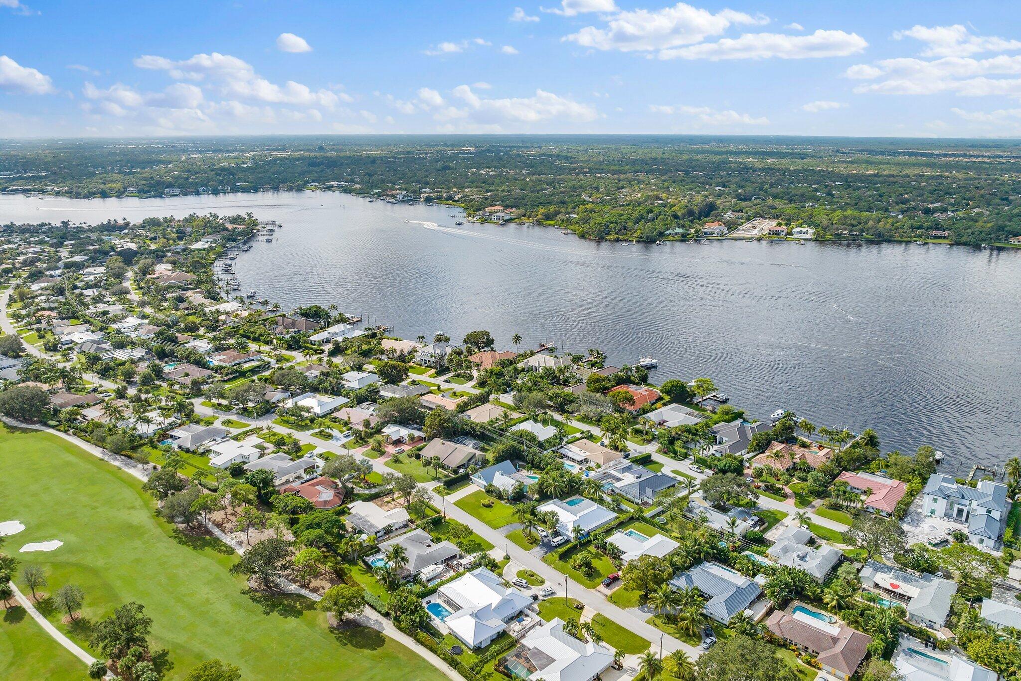 248 River Drive Tequesta, FL 33469 - Photo 37 of 65 a view of a lake with a city