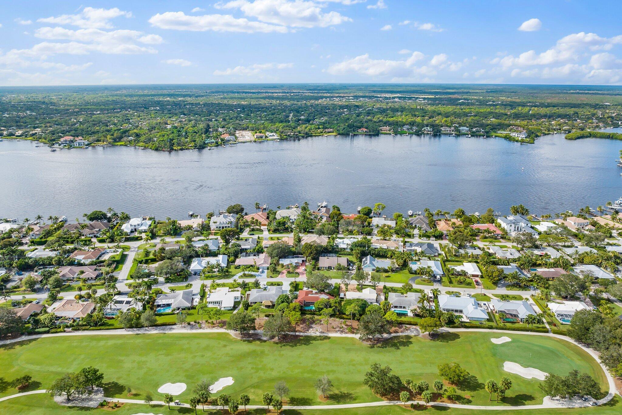 248 River Drive Tequesta, FL 33469 - Photo 38 of 65 a view of a lake with a city