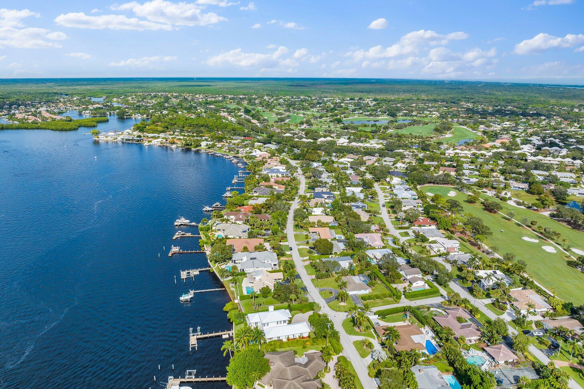 248 River Drive Tequesta, FL 33469 - Photo 40 of 65 a view of a lake with a city