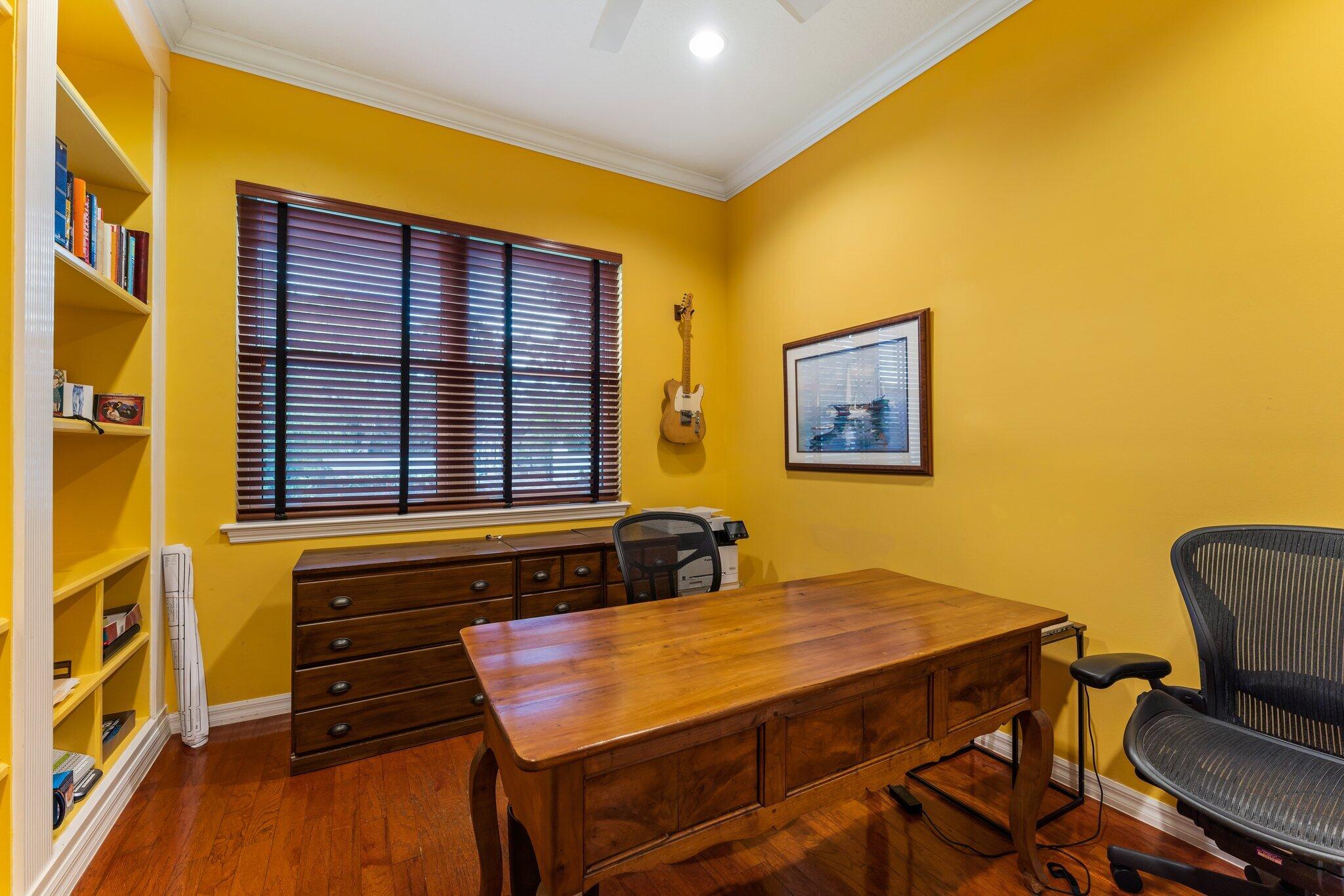 248 River Drive Tequesta, FL 33469 - Photo 47 of 65 a bedroom with a bed and wooden floor