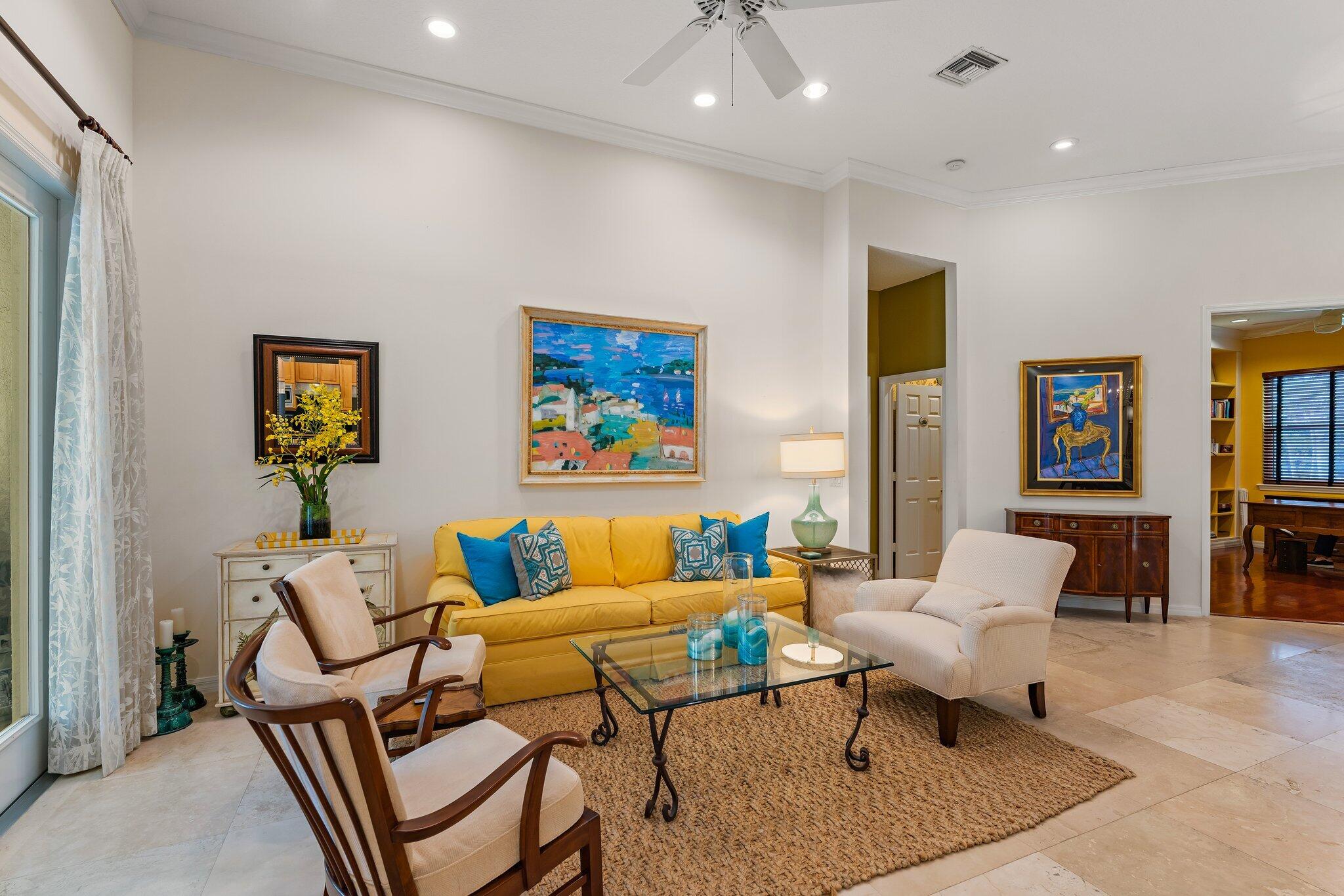 248 River Drive Tequesta, FL 33469 - Photo 50 of 65 a living room with furniture or couch and a bookshelf