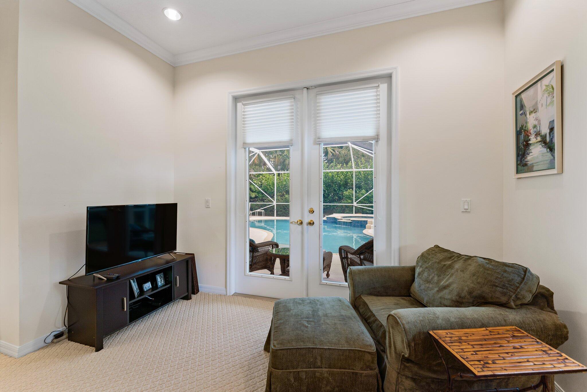 248 River Drive Tequesta, FL 33469 - Photo 53 of 65 a living room with furniture and a flat screen tv