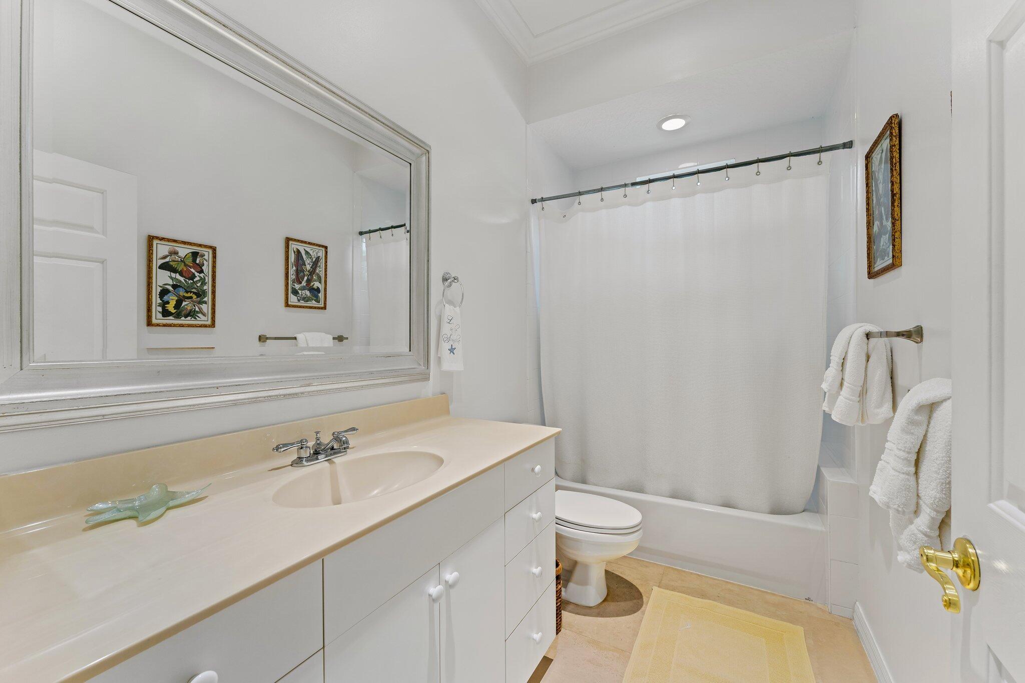 248 River Drive Tequesta, FL 33469 - Photo 60 of 65 a bathroom with a sink toilet and shower