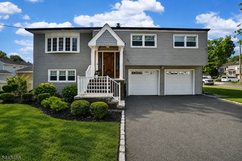 151 East Prospect Street Clark, NJ 07066 - Photo 1 of 31 a front view of a house with a garden