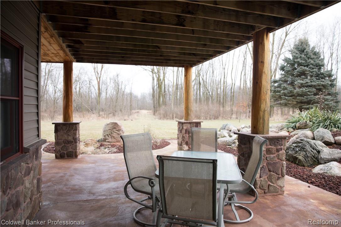 1968 East Beard Road Perry, MI 48872 - Photo 27 of 37 Lower level walkout to lush landscaping.