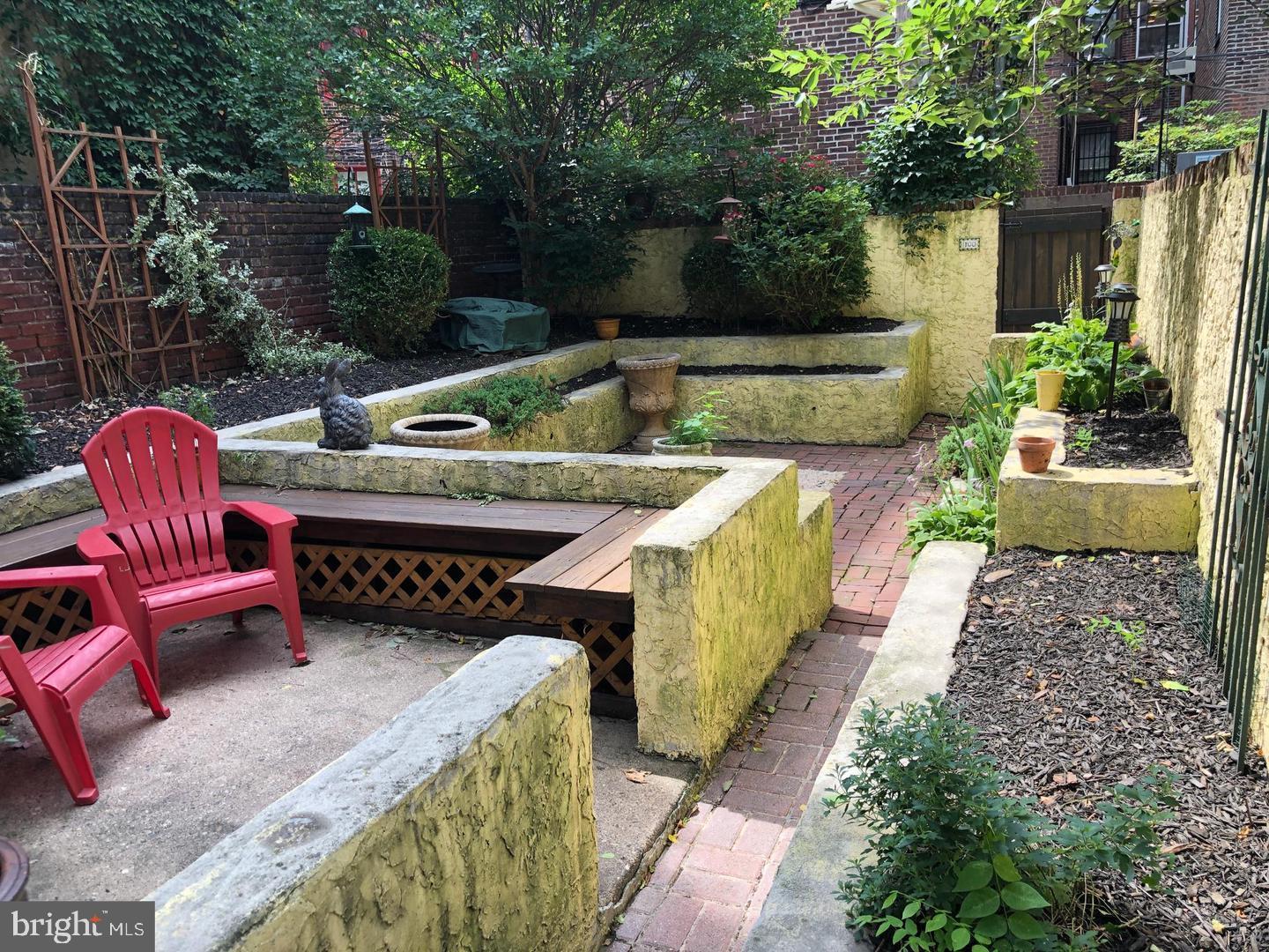 2306 Spruce Street, Unit 100 Philadelphia, PA 19103 - Photo 8 of 19 a view of backyard with outdoor seating and plants
