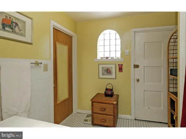 a bedroom with a bed and a view of bathroom