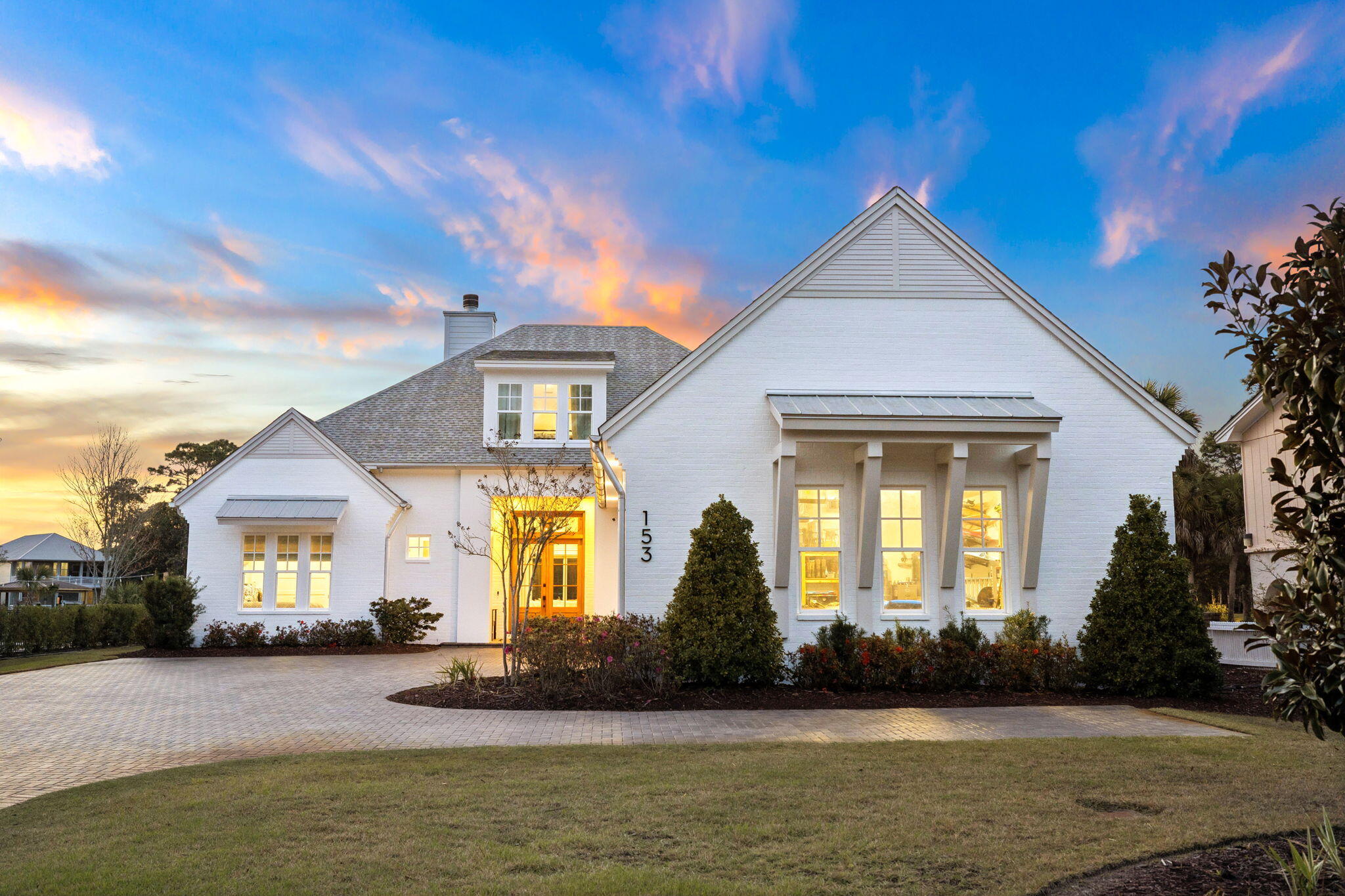 a front view of a house with garden
