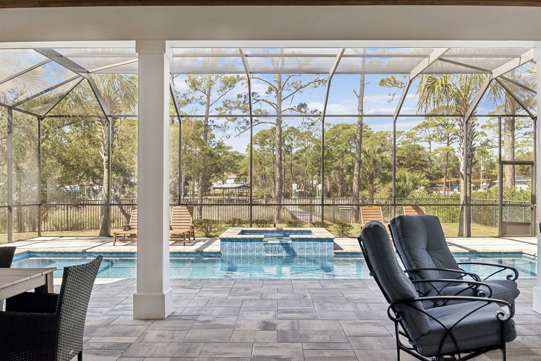 153 Blue Bell Circle Santa Rosa Beach, FL 32459 - Photo 15 of 18 a living room with a floor to ceiling window and outdoor view