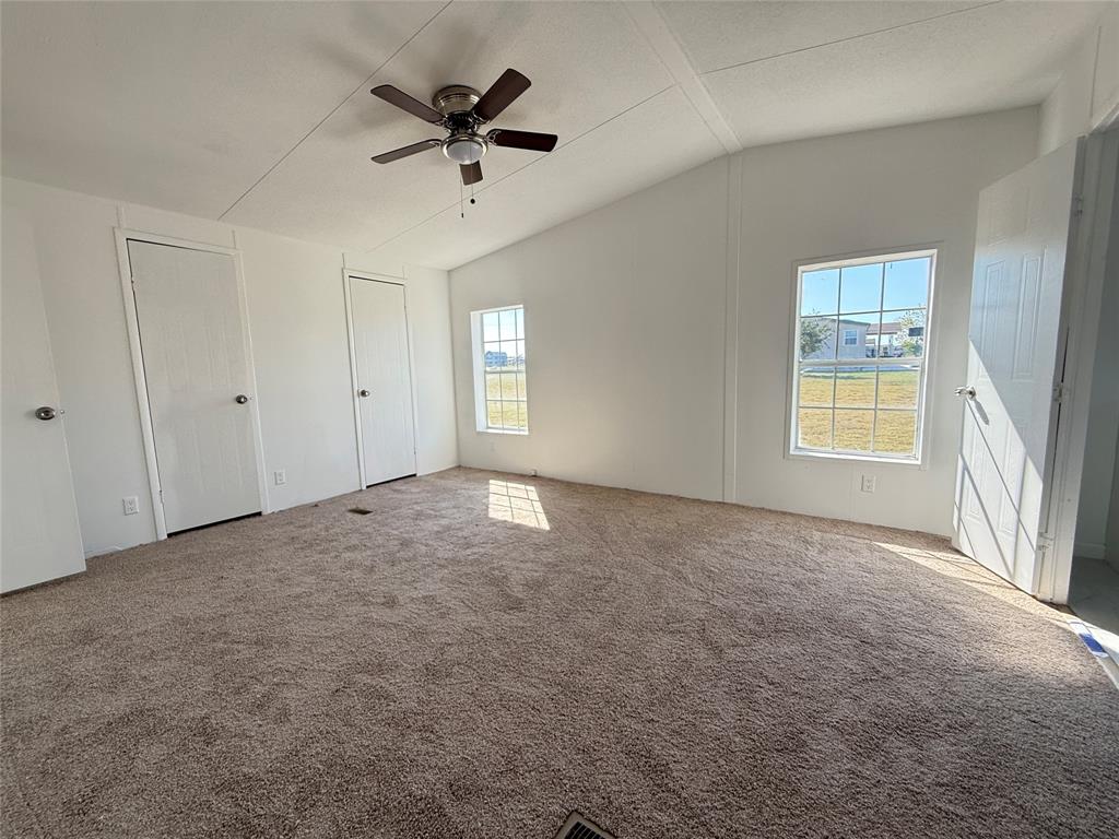 835 Private Road 4732 Rhome, TX 76078 - Photo 15 of 30 a view of a livingroom with a ceiling fan and window