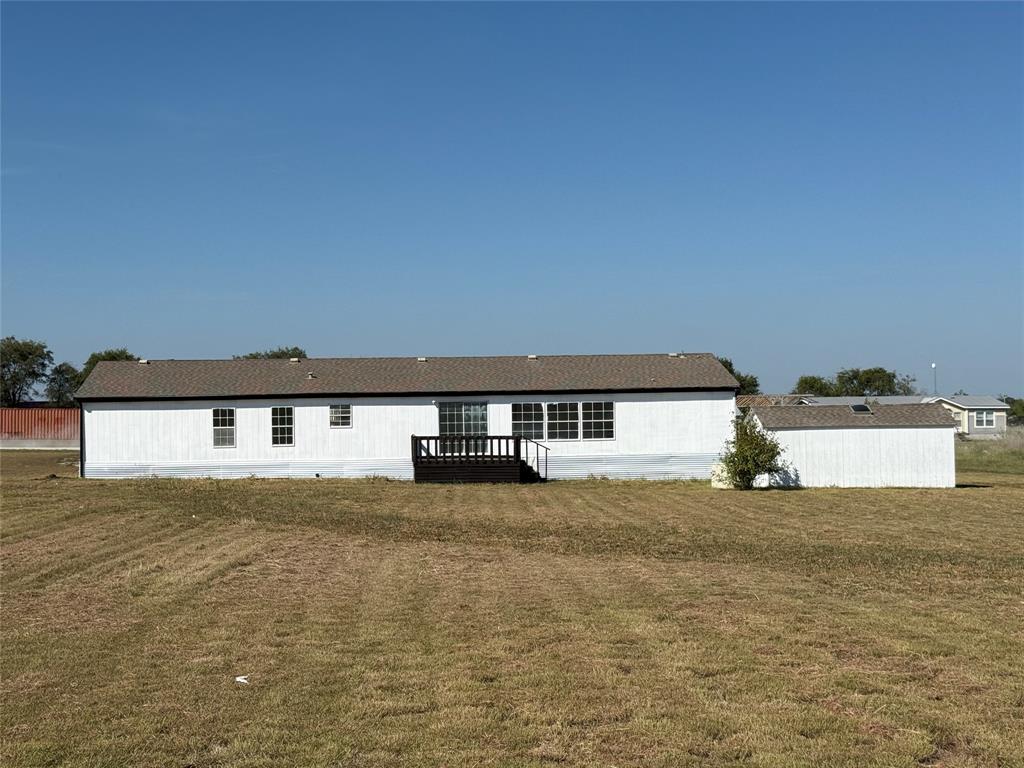 835 Private Road 4732 Rhome, TX 76078 - Photo 2 of 30 a view of a big yard next to a building