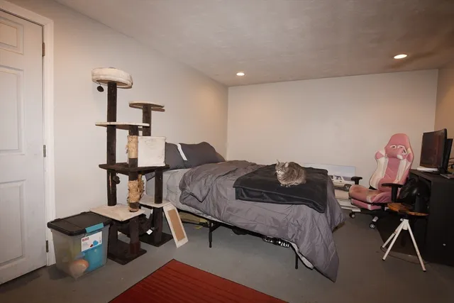 a bedroom with furniture and a window