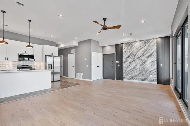 a view of a kitchen with wooden floor