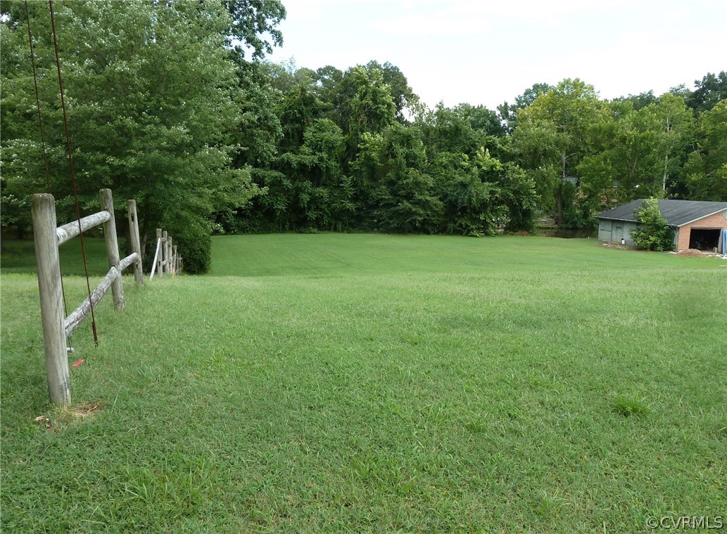 a view of field with trees in the background