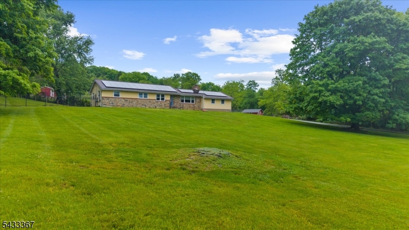 650 Woodglen Road Glen Gardner, NJ 08826 - Photo 3 of 28 a view of a big yard with a house
