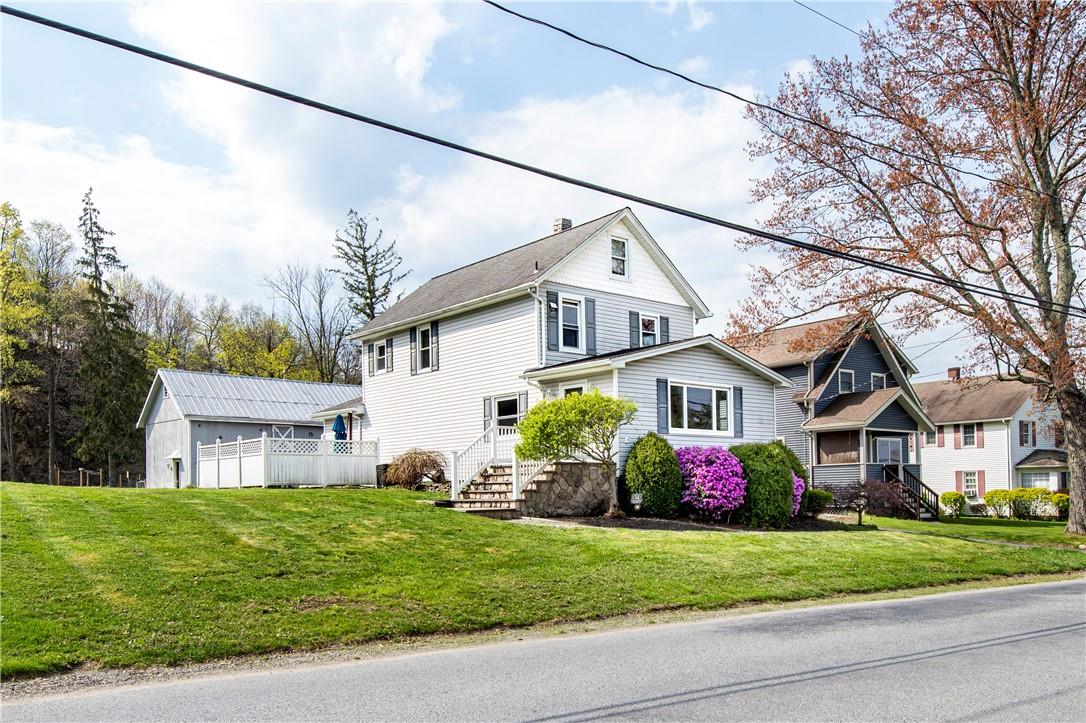 34 Glenmere Avenue Florida, NY 10921 - Photo 1 of 1 a front view of a house with a yard and garage