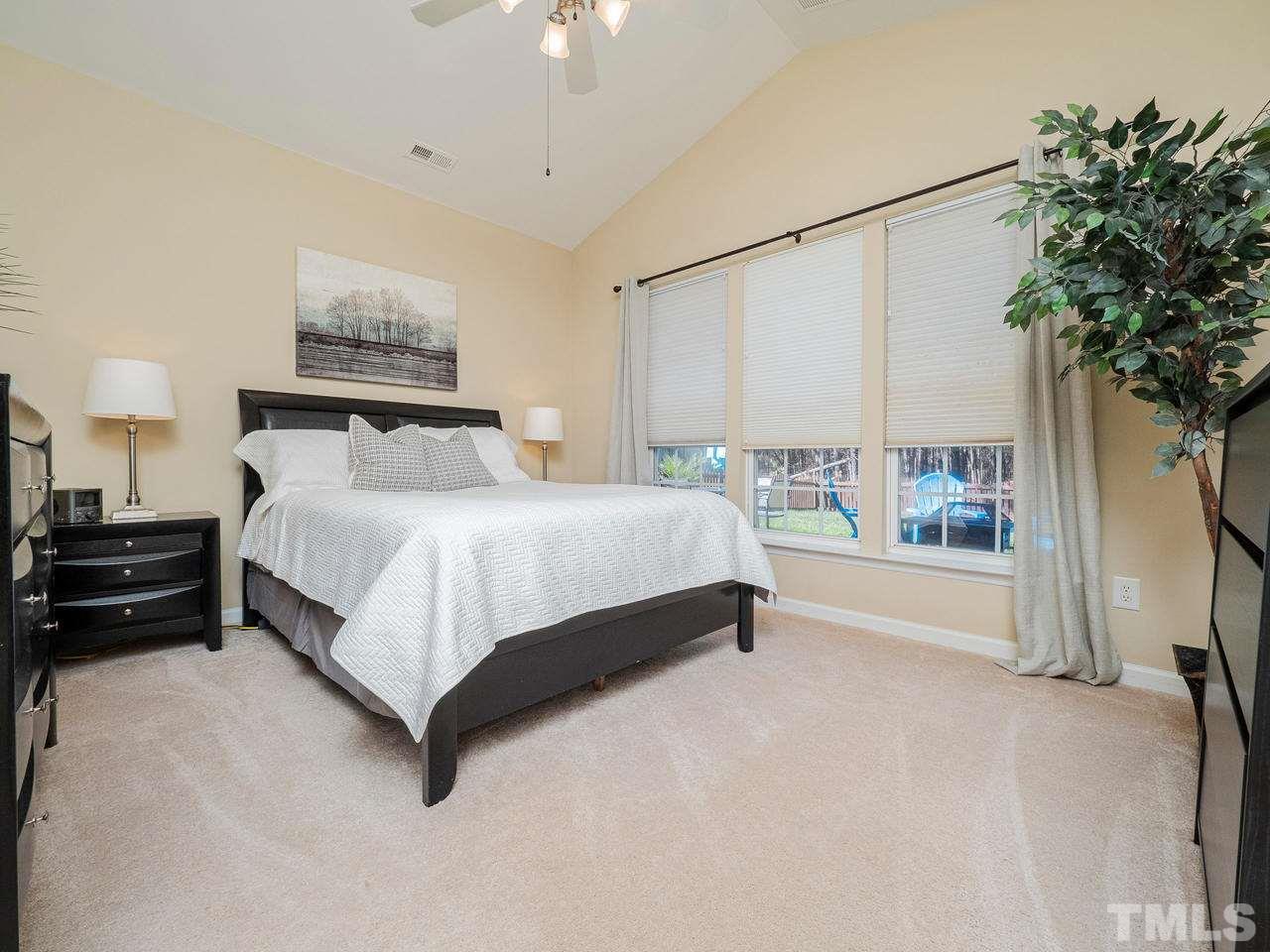 8429 Whisper Ridge Place Raleigh, NC 27613 - Photo 11 of 27 The main floor master boasts vaulted ceilings and walk-in closet