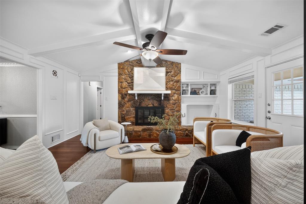 9660 Timberleaf Drive Dallas, TX 75243 - Photo 6 of 40 Spacious living area featuring vaulted white ceilings with exposed beams, a ceiling fan, and rich wood-finish flooring