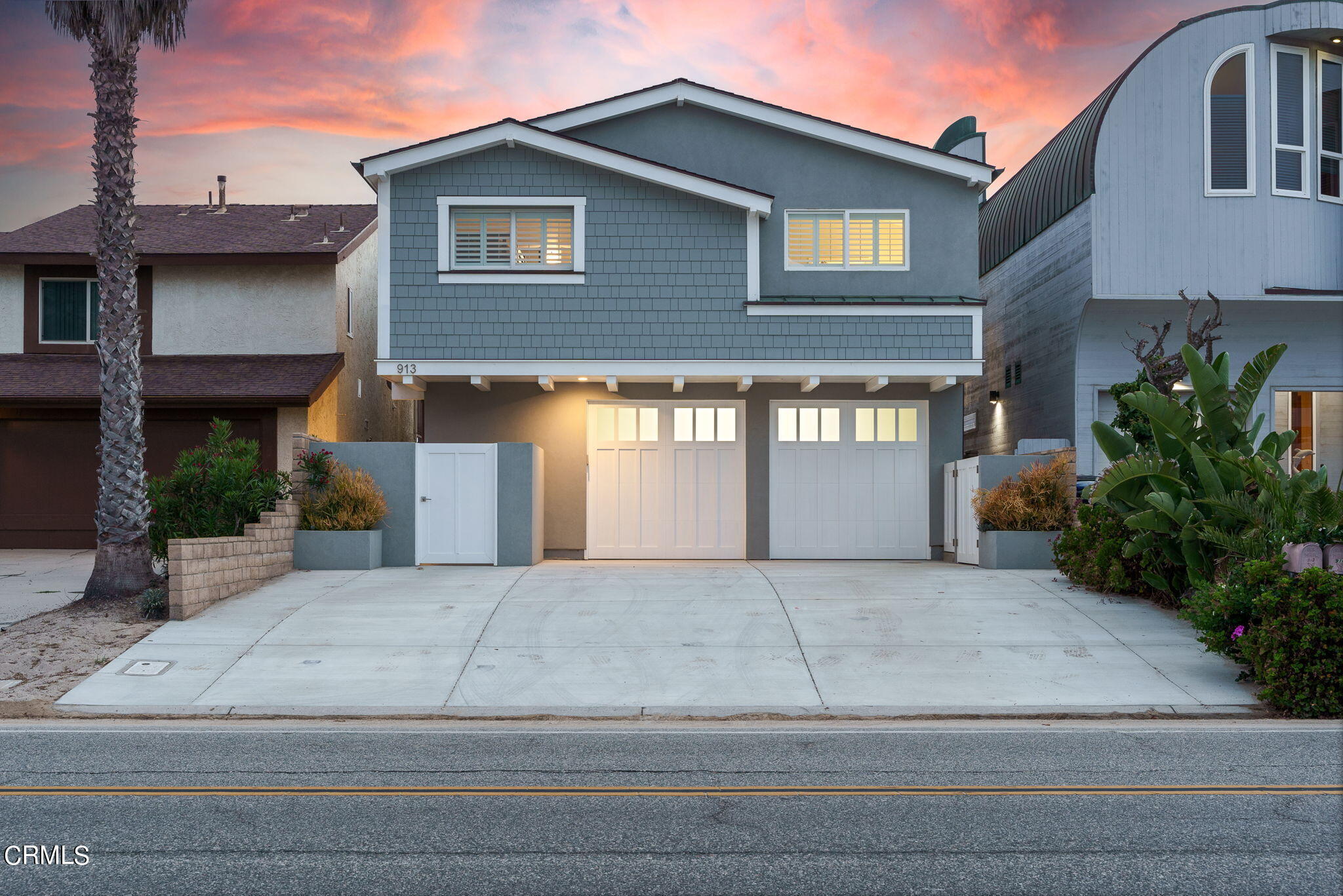 a view of a house with a yard and garage