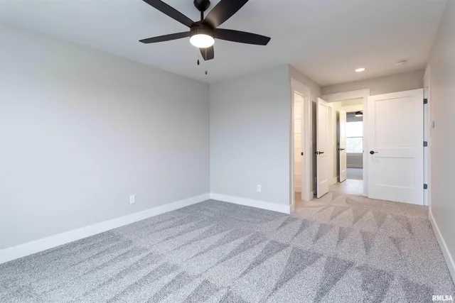 wooden floor in an empty room and a bathroom
