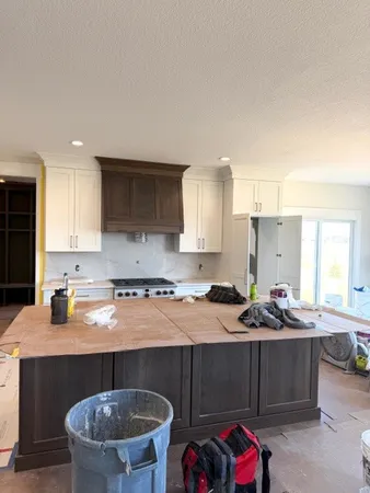 a kitchen with a sink and cabinets