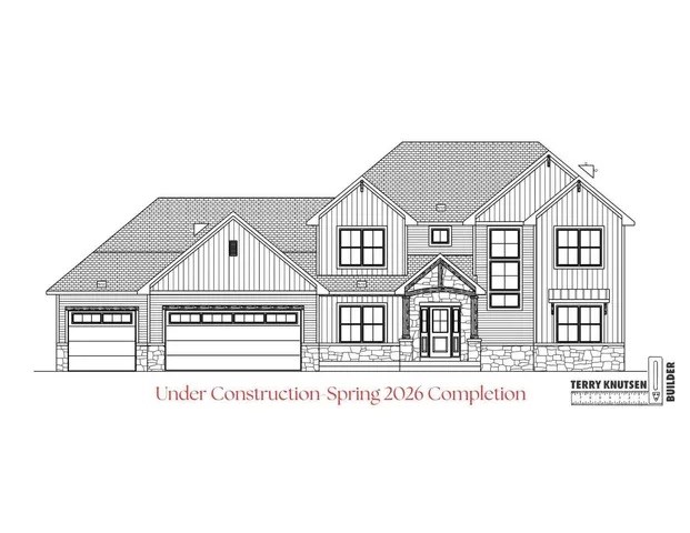 a black and white photo of a house next to a road