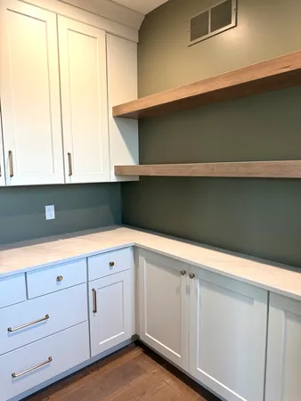 a view of cabinets and window
