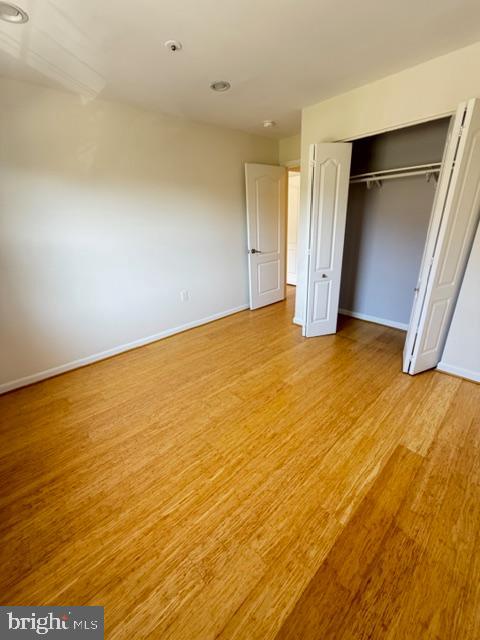 8399 Montgomery Run Road, Unit I Ellicott City, MD 21043 - Photo 16 of 26 an empty room with a natural light