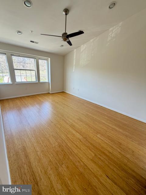 8399 Montgomery Run Road, Unit I Ellicott City, MD 21043 - Photo 17 of 26 wooden floor in an empty room