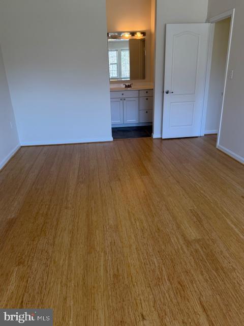 8399 Montgomery Run Road, Unit I Ellicott City, MD 21043 - Photo 19 of 26 wooden floor in an empty room