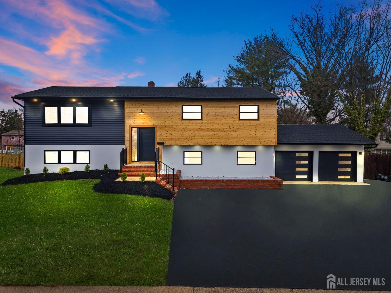 12 Barker Road Somerset, NJ 08873 - Photo 1 of 43 a front view of a house with a yard