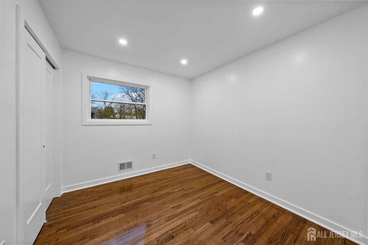 12 Barker Road Somerset, NJ 08873 - Photo 26 of 43 a view of empty room with wooden floor